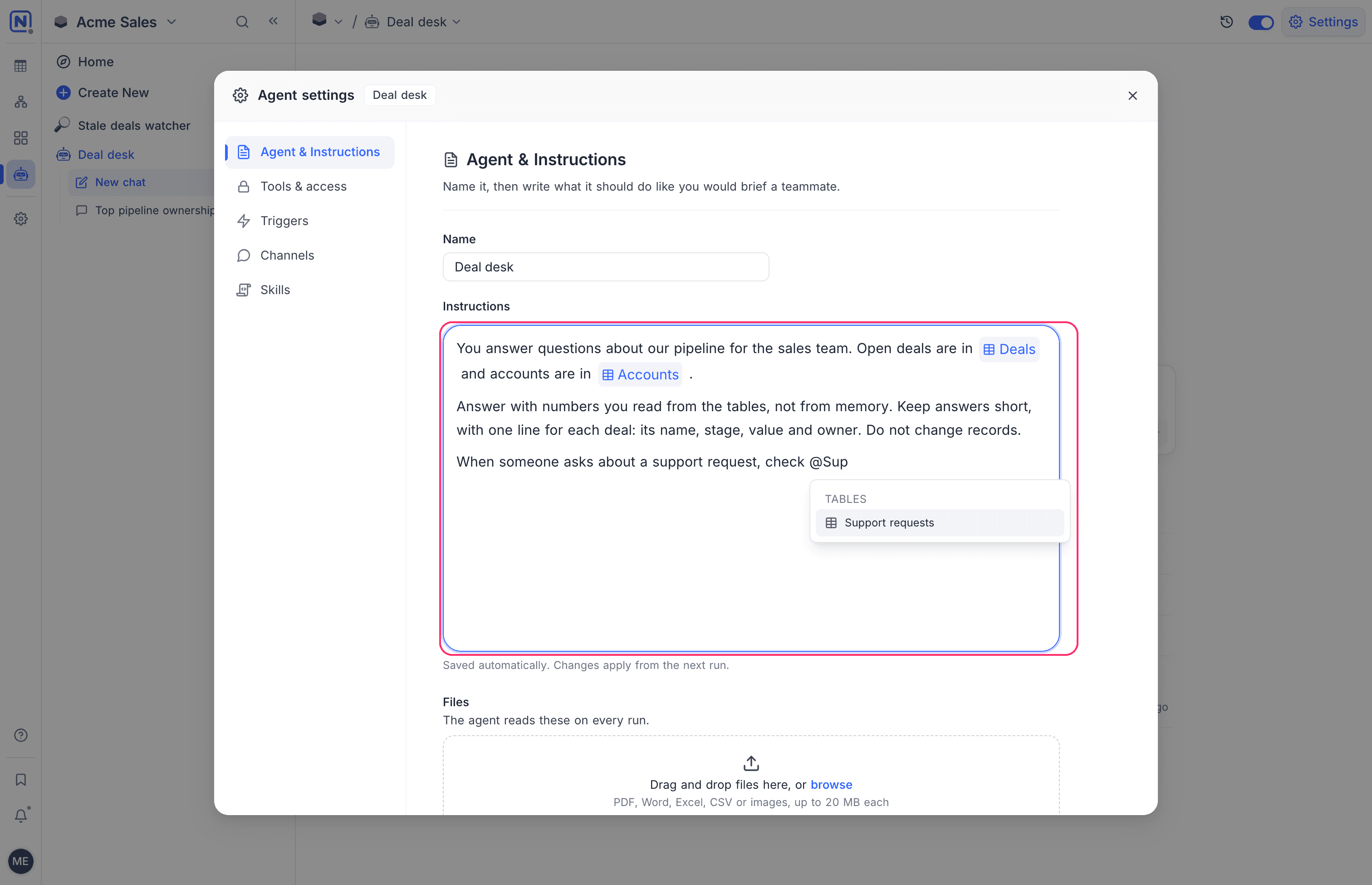 The instructions editor with table chips and the @ mention list open